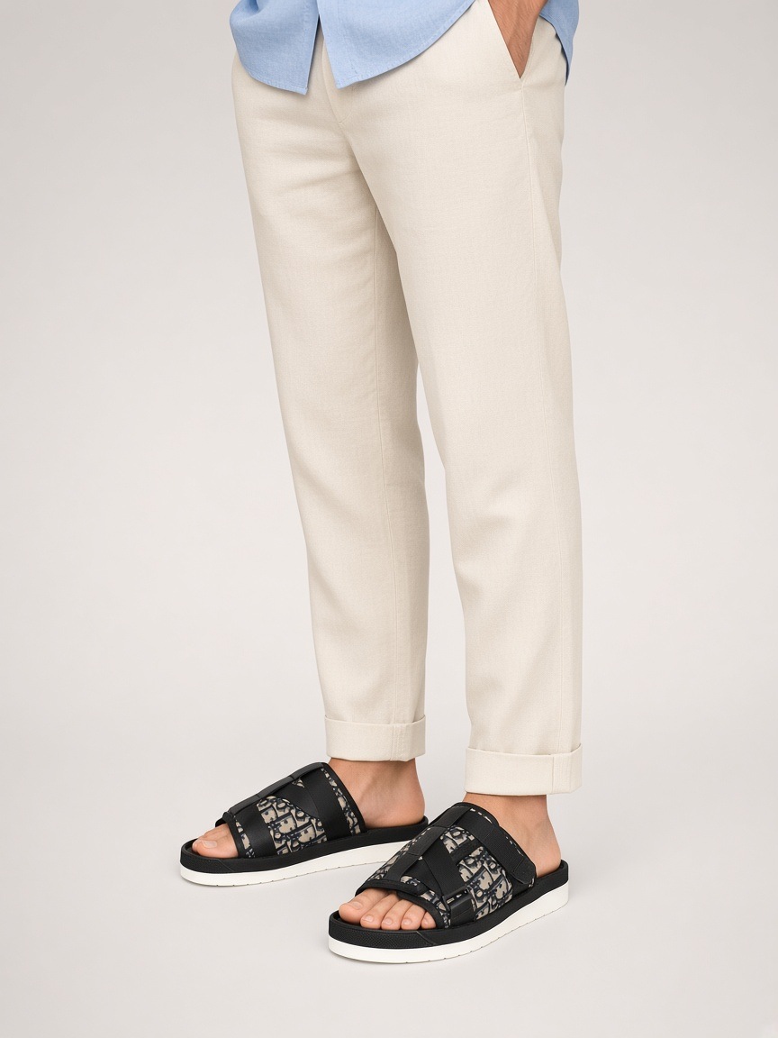 Dior Alpha sandal in Beige and Black Dior Oblique jacquard, worn by a model