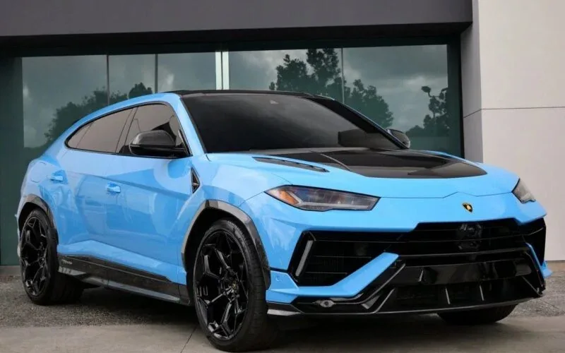 Baby blue Lamborghini Urus with black wheels